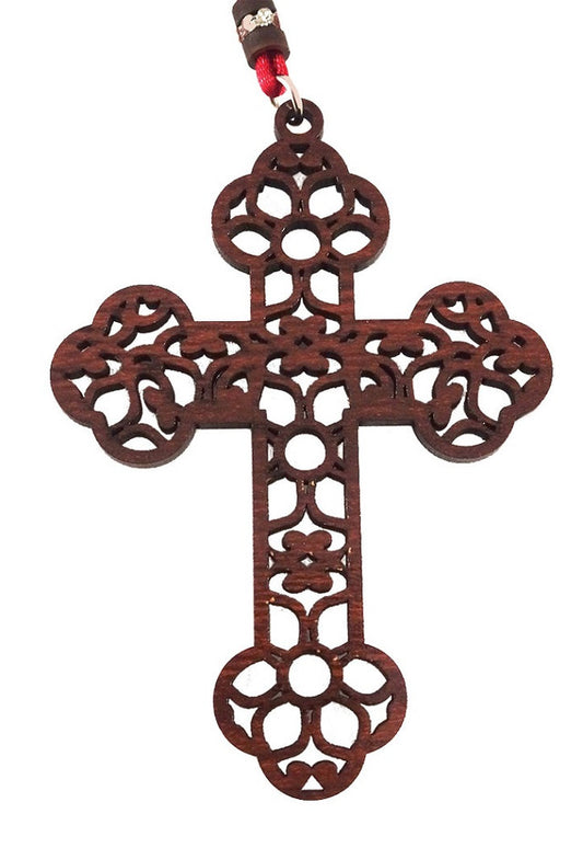 Cross, ornate cut-out floral and vine design